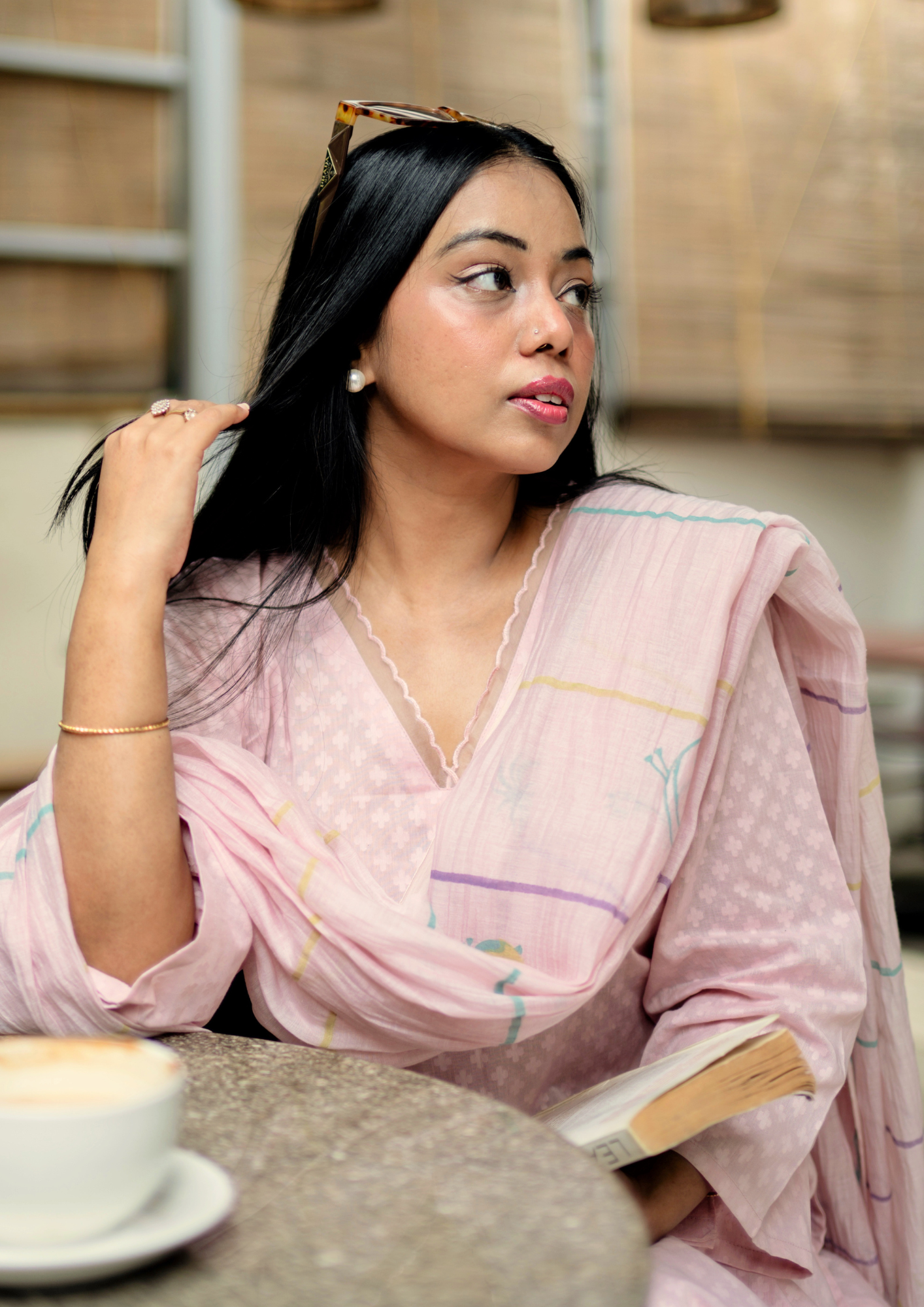 A bengali woman wearing a light pink colour Pure cotton Indian Suit with a matching chanderi dupatta.